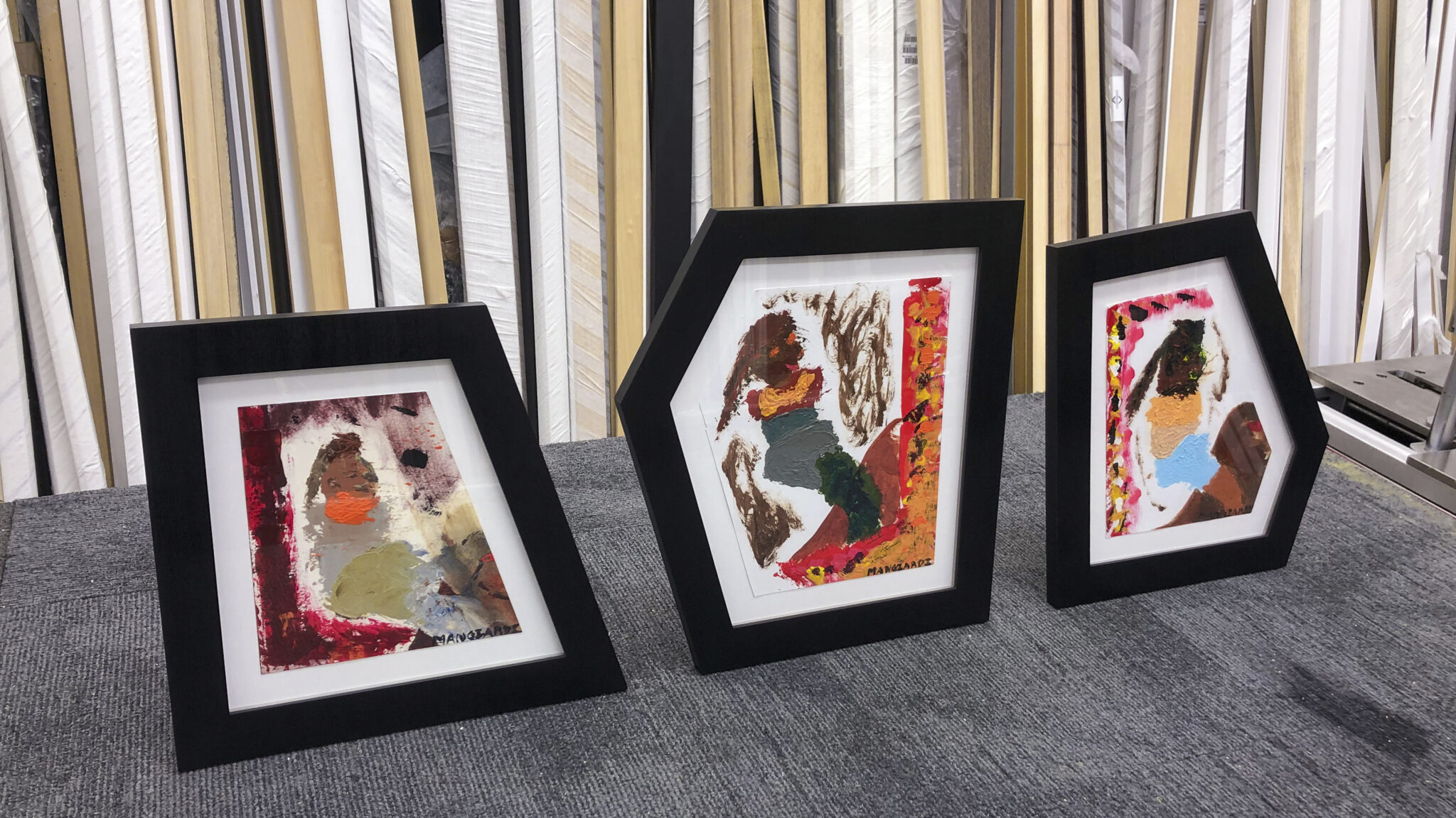 Irregular shaped custom carved black tulip wood frames