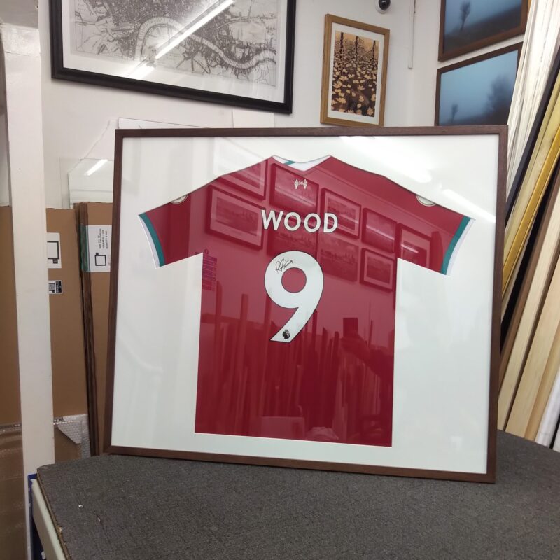 A football shirt in a frame