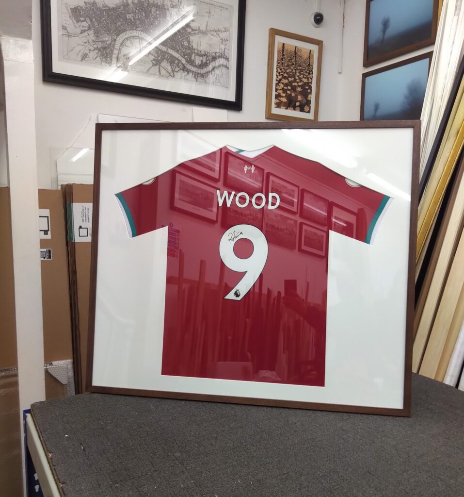 A football shirt in a frame