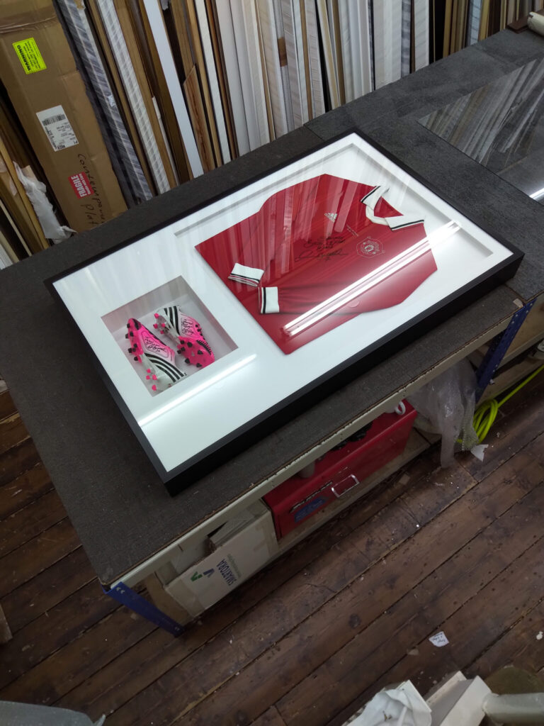 Custom made football shirt and boots frame