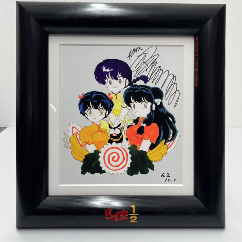 Framed illustration of three anime characters with autographs, featuring "Ranma ½" logo in red enamel carved into the polished black picture frame