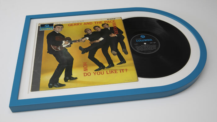 A Vinyl Record Framing of Gerry and the Pacemakers' "How Do You Like It?" on display.