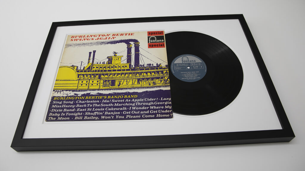 Framed vinyl record with illustrated cover titled "Burlington Bertie's Banjo Band Swings Again.
