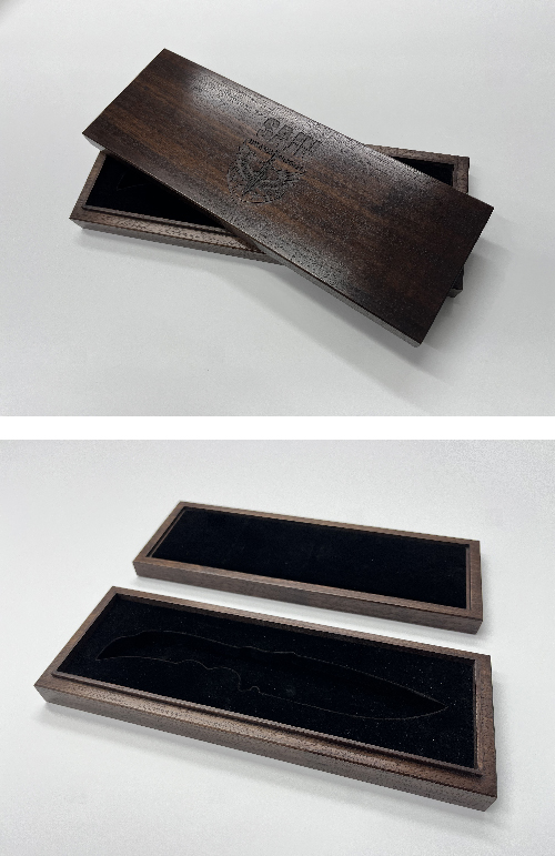 A rectangular walnut wood box with a sliding lid, shown open and closed, lined with black velvet.