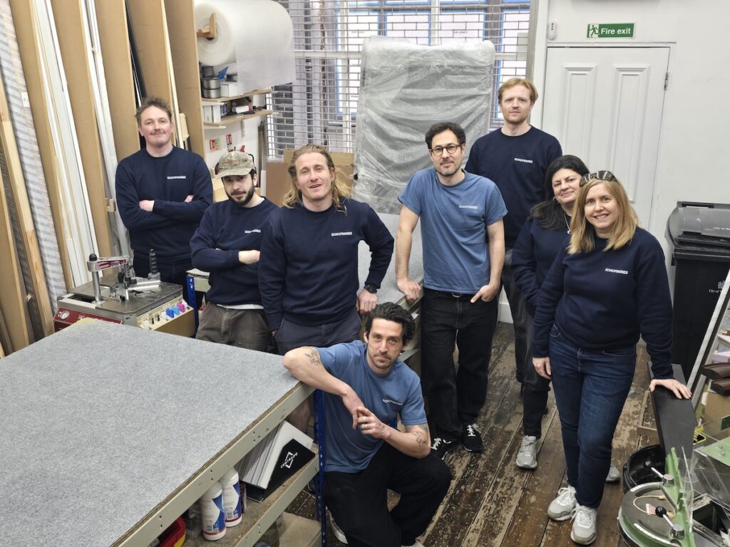 SohoFrames team photograph in the ground floor of their workshop