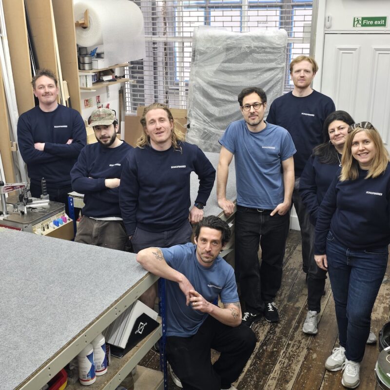 SohoFrames team photograph in the ground floor of their workshop