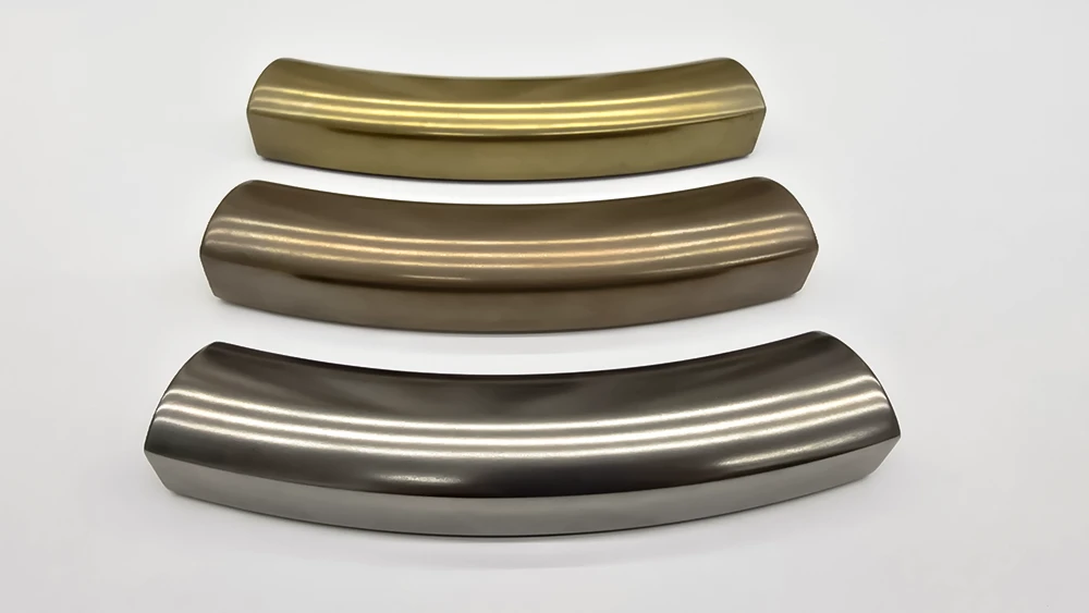 three curved picture frame sections with liquid metal finishes