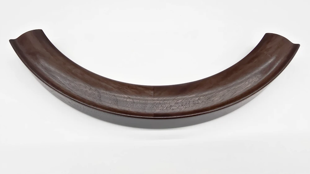 curved walnut round mirror frame section with cushion profile on white background