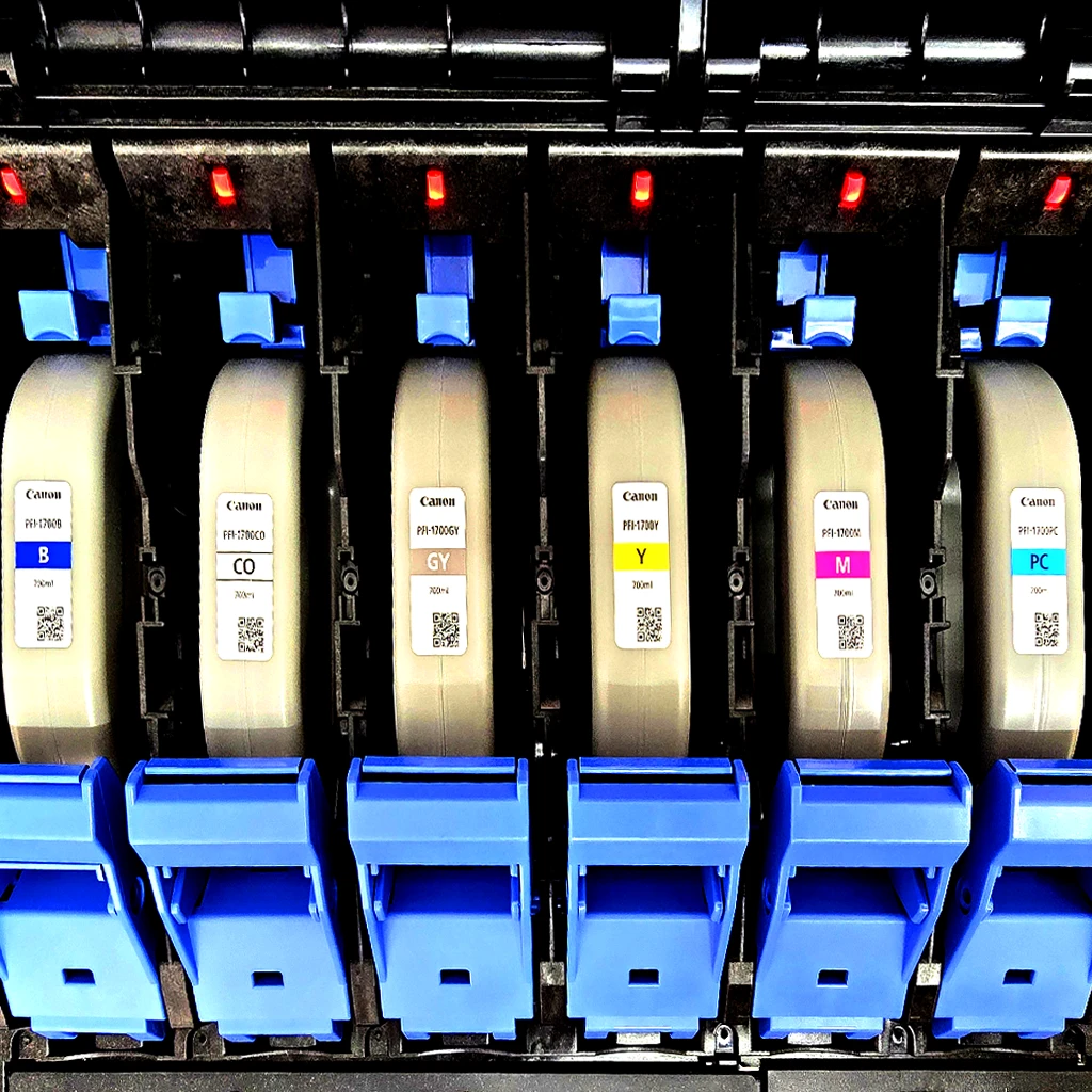 Canon ink cartridges inside a commercial print machine