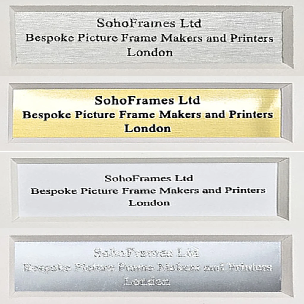 four engraved plaques made of different types of metal, brass and aluminium silver