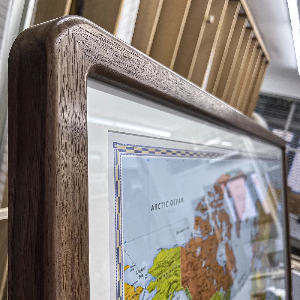 Close-up of a walnut rounded corner picture frame