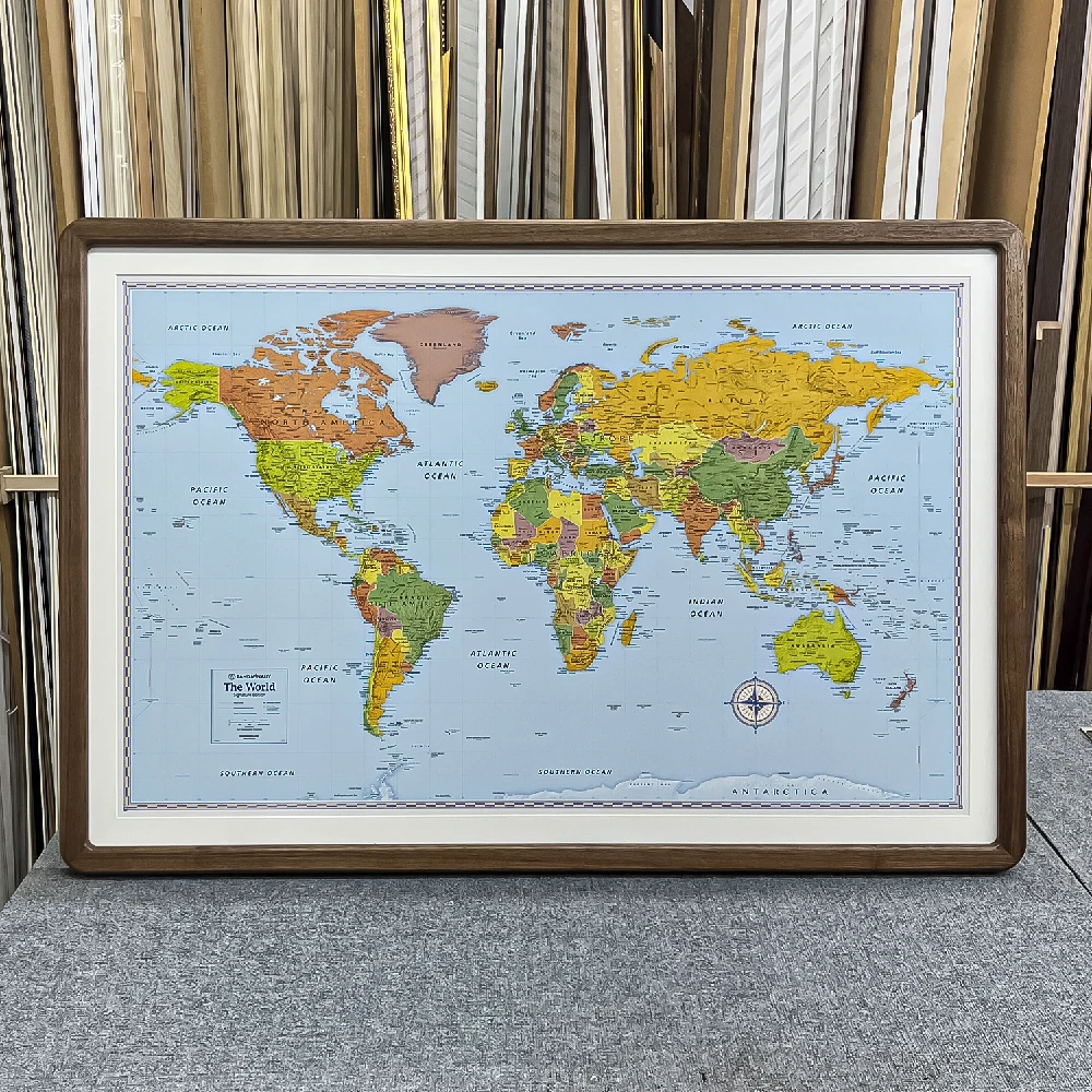 a rounded corner picture frame featuring a map of the world in a framing workshop