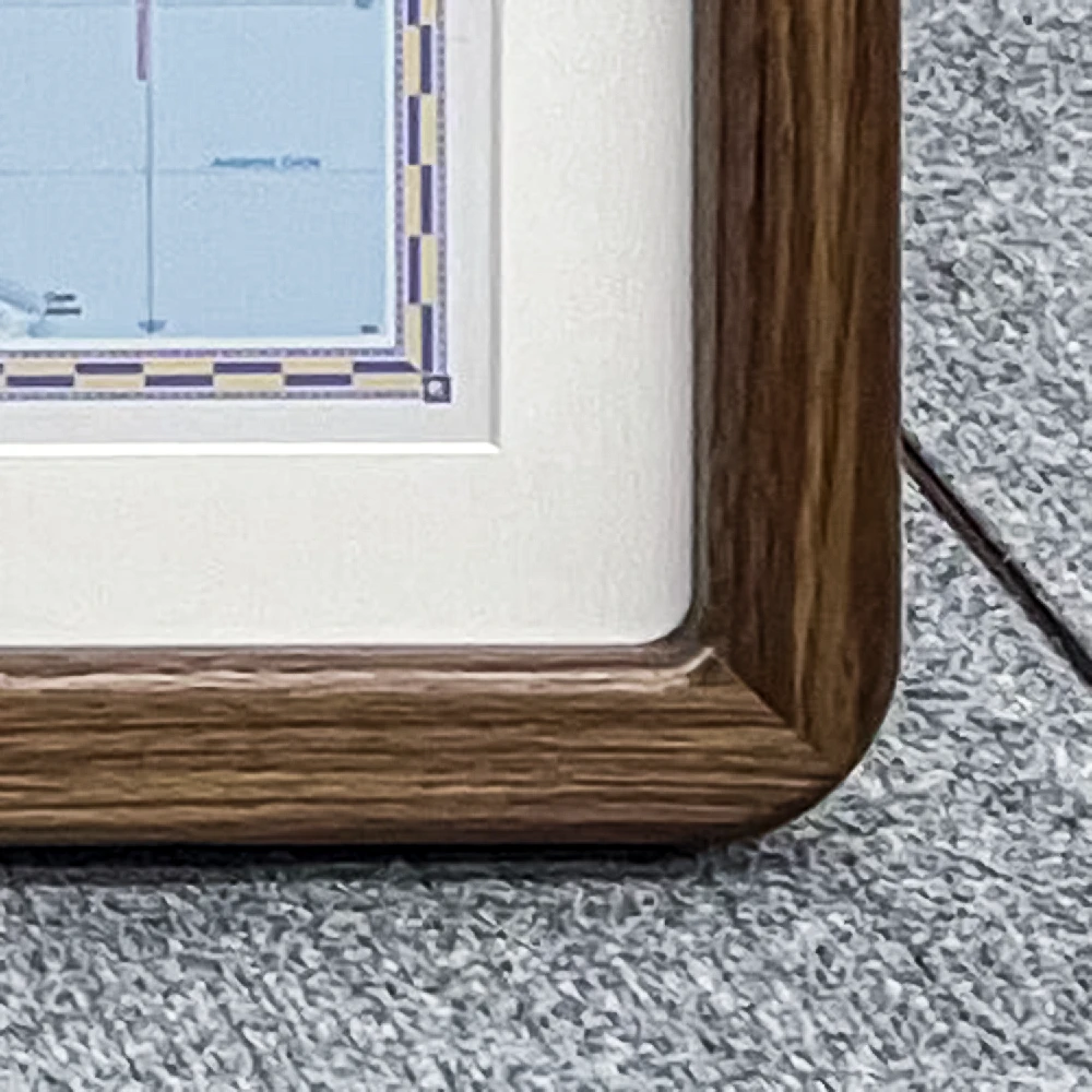 close up of a walnut rounded corner picture frame