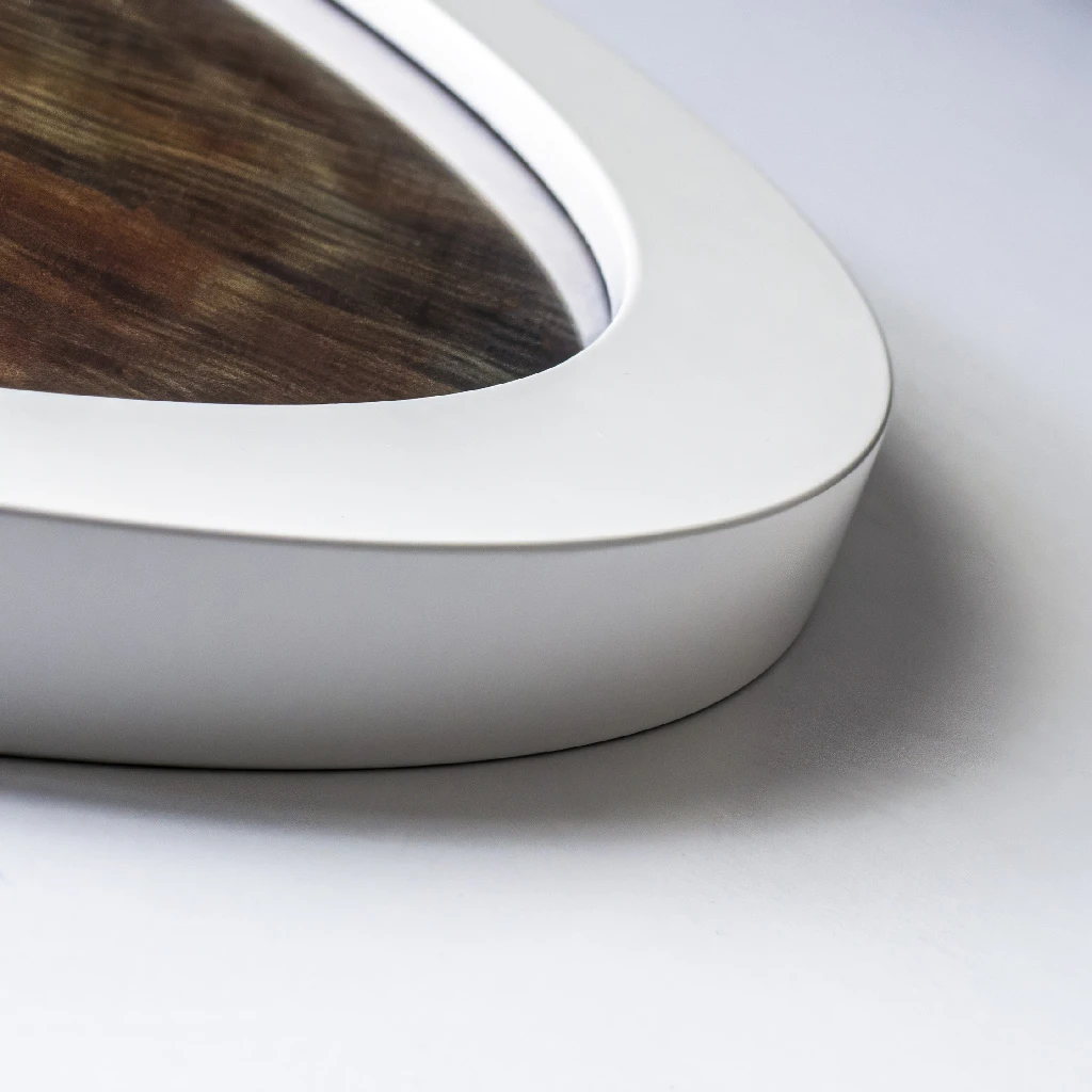 A close-up of a white round picture frame