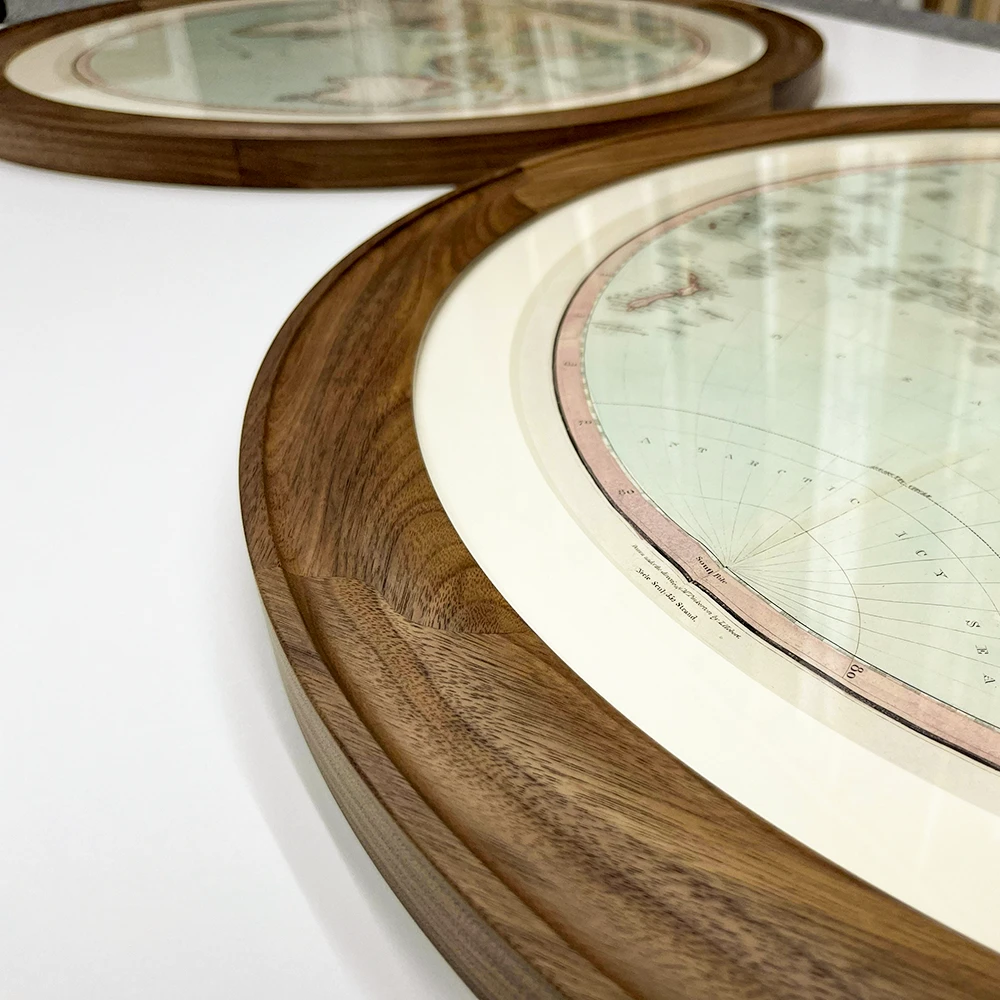 A section of a circular frame with a 50mm wide cushion profile made from polished walnut