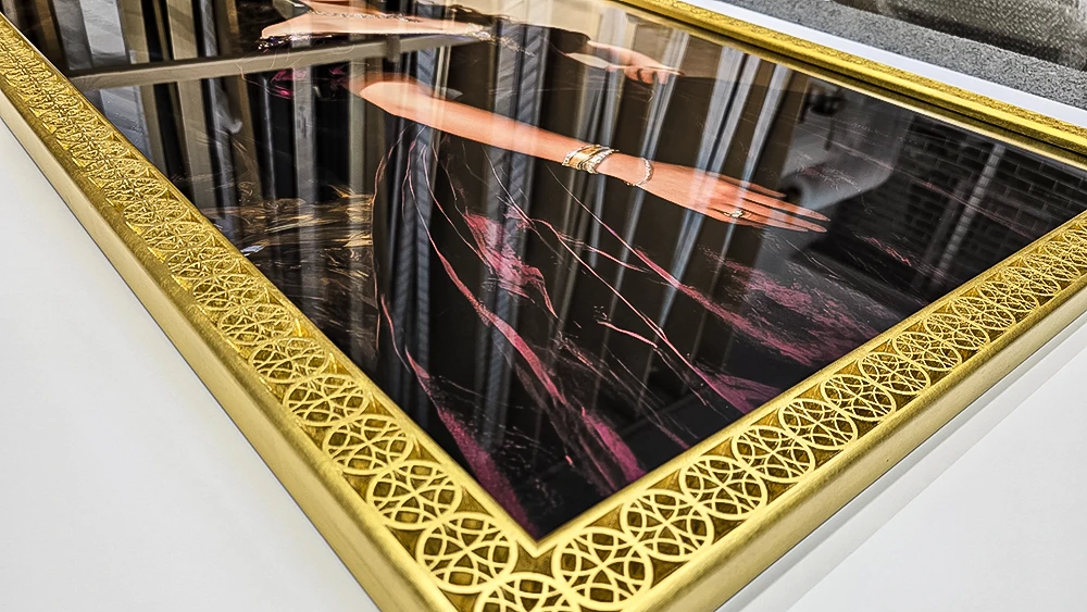 custom carved Qatar design picture frame in 22k gold.